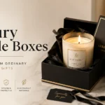 Luxury candle boxes in a premium rigid gift box with gold foil details on a modern marble tabletop.